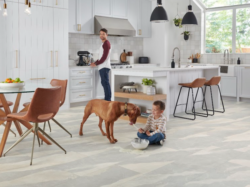 Child and dog playing on a durable Versatech floor in a family home